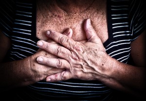 Close up of an old woman's hands over her chest